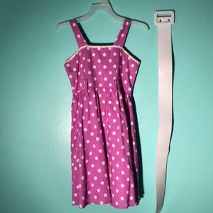 Purple dress, White polka dots, and white belt.